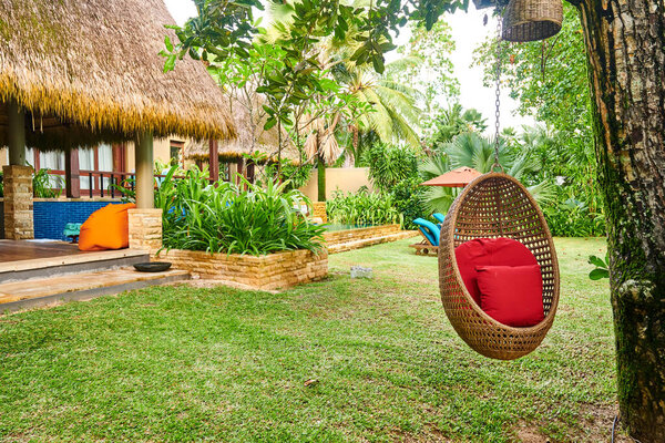 Beach swing egg chair at Mahe, Seychelles