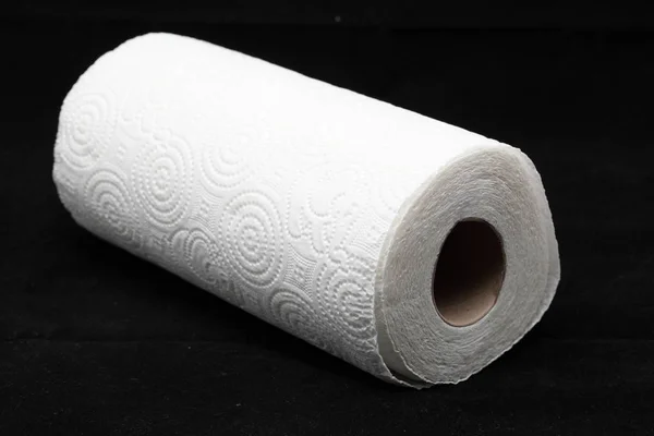 roll of paper on a black background