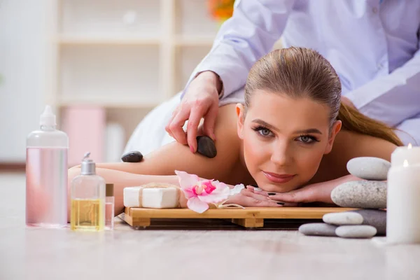 Young woman during spa procedure in salon