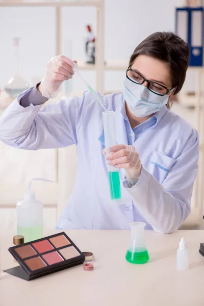 Lab chemist checking beauty and make-up products