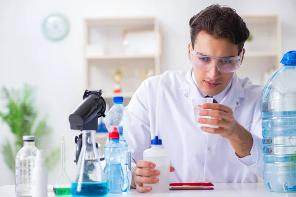 Lab assistant testing water quality