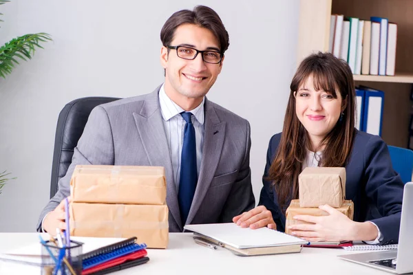 Business people receiving new mail and parcels