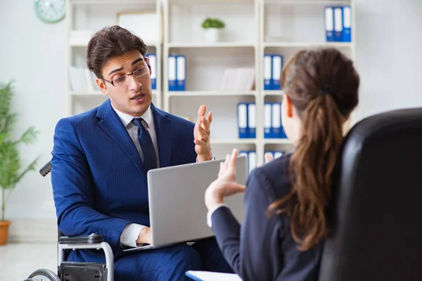 Disabled businessman having discussion with female colleague — Stock Photo, Image
