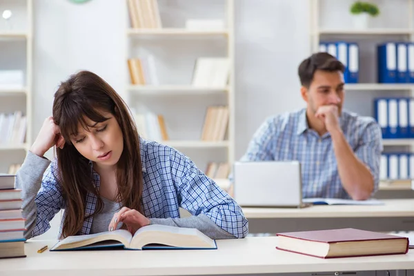 Students sitting and studying in classroom college Stock Photo