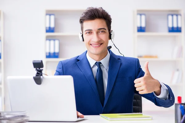 Young help desk operator working in office — Stock Photo, Image