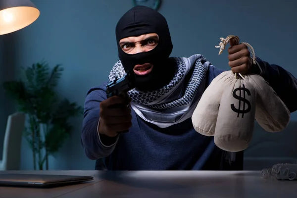 Terrorist burglar with gun asking for money ransom