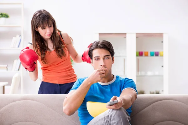 Wife unhappy that husband is watching boxing — Stock Photo, Image