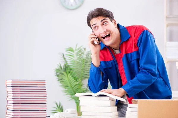 Worker in publishing house preparing book order