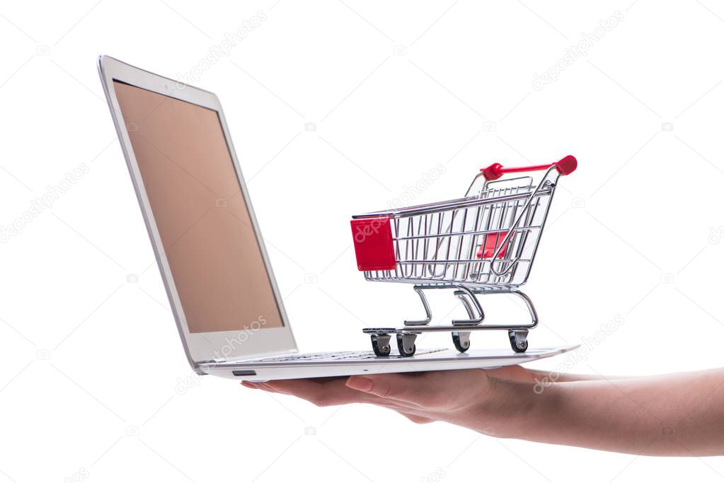 Online shopping concept with laptop and trolley