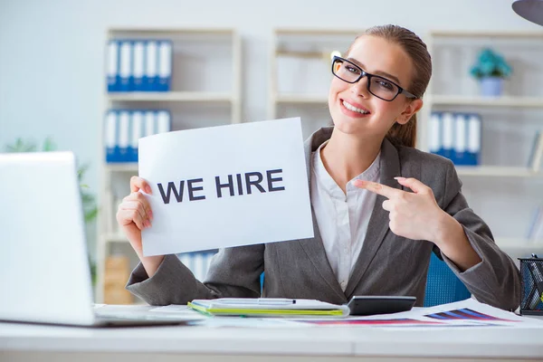 Businesswoman sitting in office with message — Stock Photo, Image