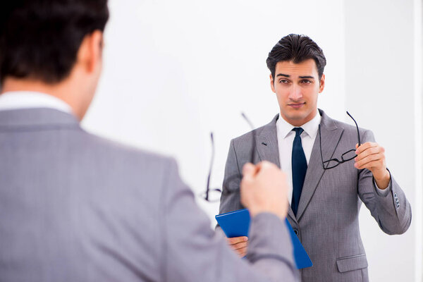 Politician planning speach in front of mirror