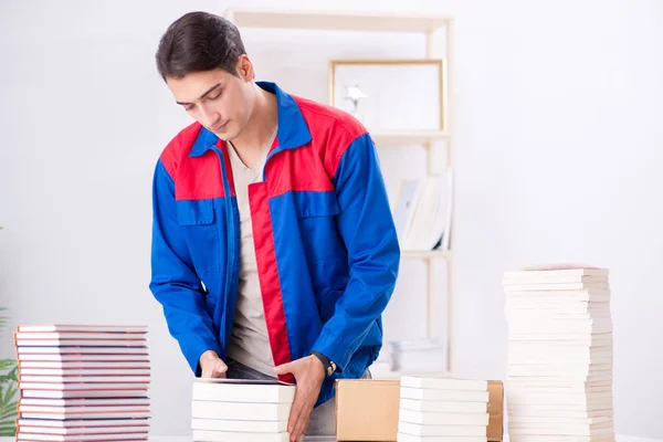 Worker in publishing house preparing book order