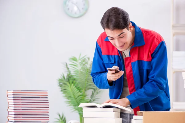 Worker in publishing house preparing book order