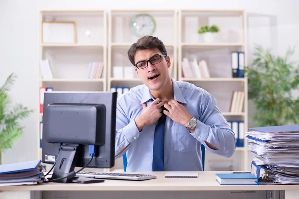 Tired businessman with too much paperwork