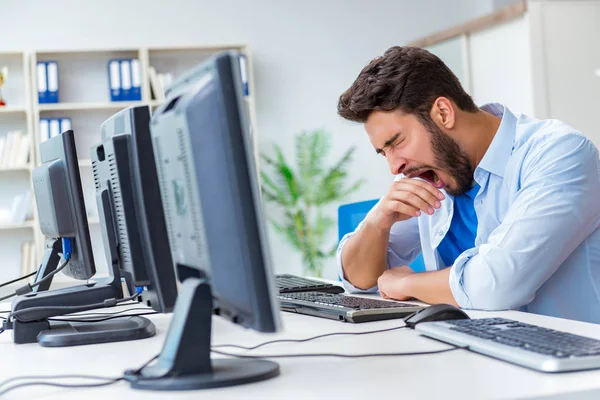 Businessman sitting in front of many screens — Stock Photo, Image