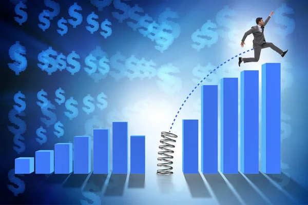 Business people jumping over bar charts — Stock Photo, Image