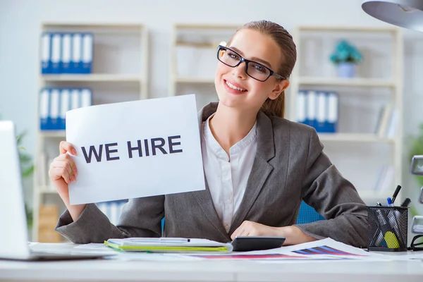 Businesswoman sitting in office with message — Stock Photo, Image