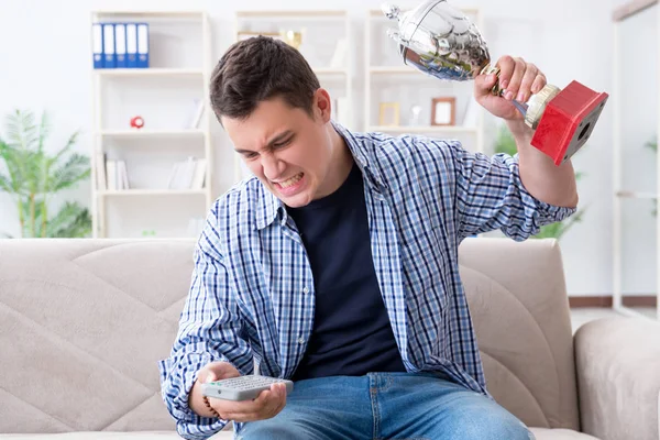 Young man student watching football at home — Stock Photo, Image