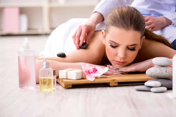 Young woman during spa procedure in salon