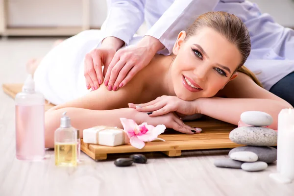 Young woman during spa procedure in salon