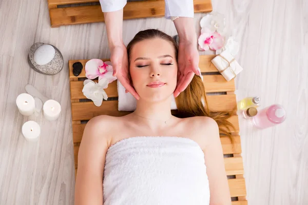 Young woman during spa procedure in salon