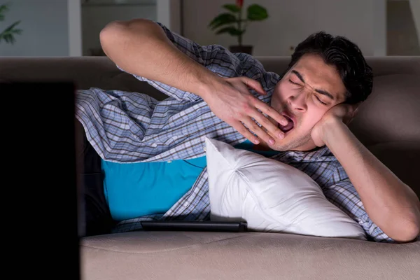 Young man watching tv late at night — Stock Photo, Image