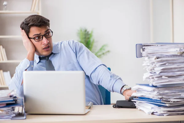 Extremely busy businessman working in office — Stock Photo, Image