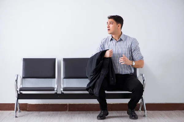 Man nervously impatiently waiting in the lobby — Stock Photo, Image