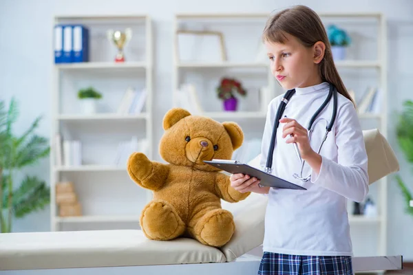 Young girl playing doctor in early development concept — Stock Photo, Image