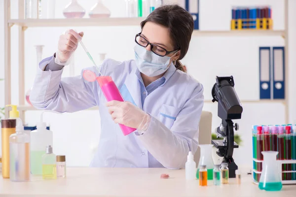 Lab chemist checking beauty and make-up products