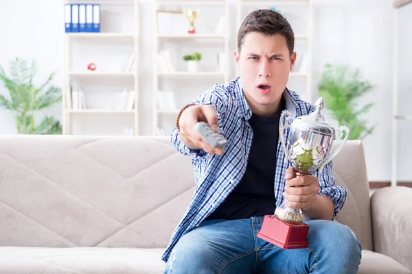 Young man student watching football at home — Stock Photo, Image