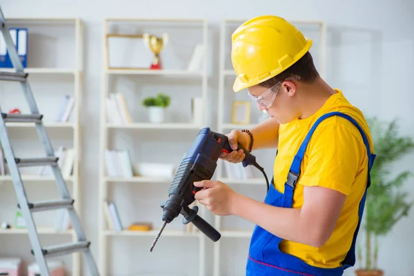 Young repairman with power drill — Stock Photo, Image