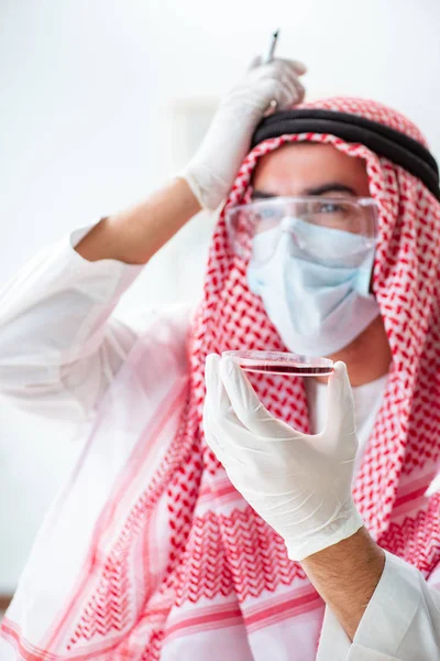 Arab doctor chemist studying new virus in lab — Stock Photo, Image