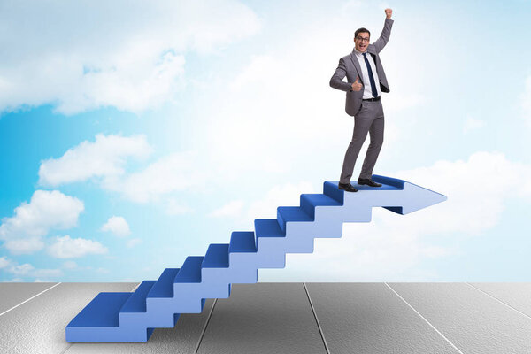 Businessman climbing career ladder in business concept