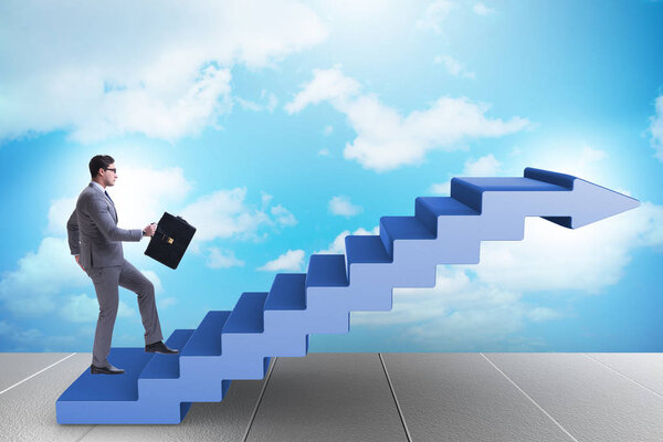 Businessman climbing career ladder in business concept