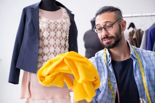 Male tailor working in the workshop on new designs — Stock Photo, Image