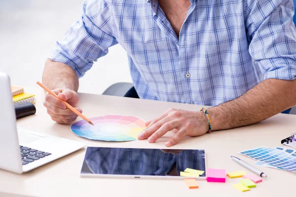 Young designer working in his studio on new project — Stock Photo, Image