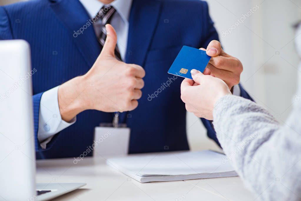 Woman makes payment with credit card 