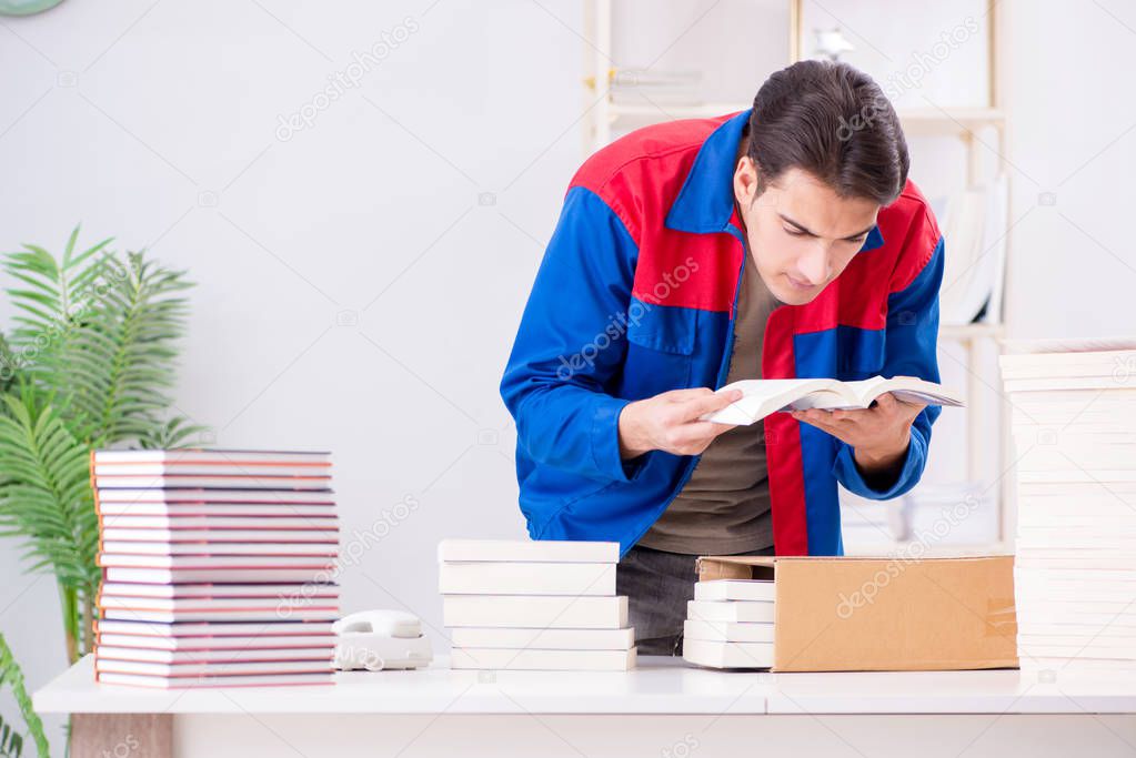 Worker in publishing house preparing book order