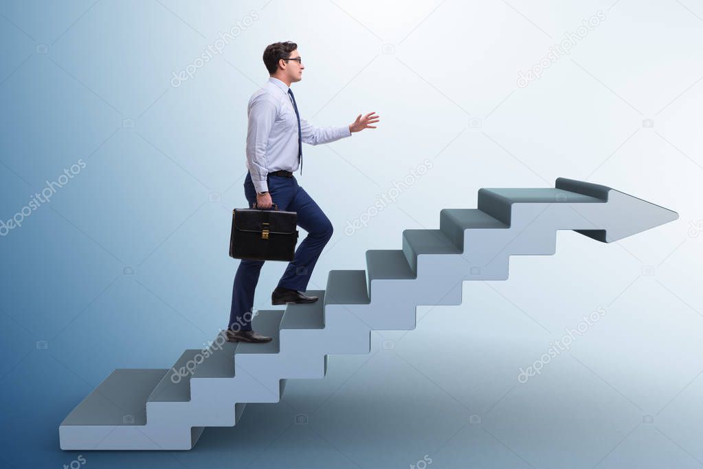 Businessman climbing career ladder in business concept