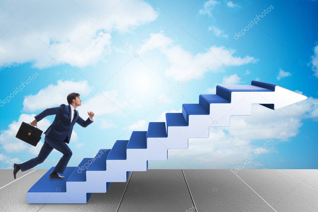 Businessman climbing career ladder in business concept