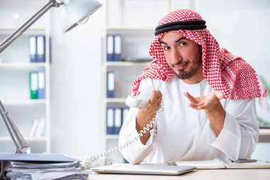Arab businessman working in the office clipart