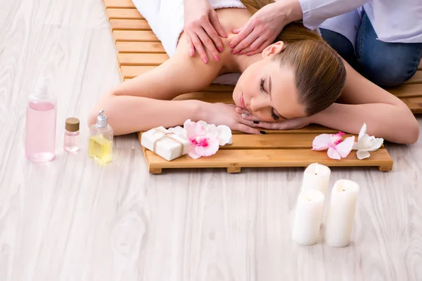 Young woman during spa procedure in salon