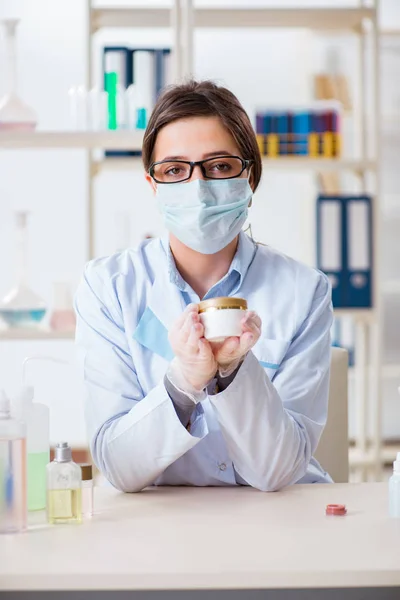 Lab chemist checking beauty and make-up products