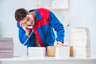 Worker in publishing house preparing book order clipart