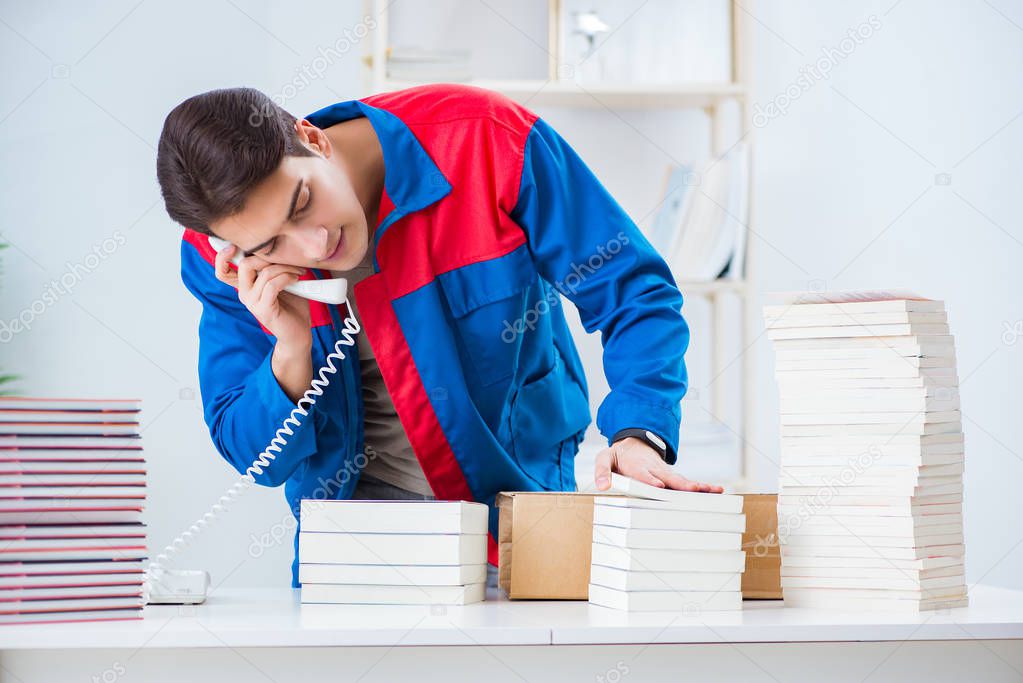 Worker in publishing house preparing book order