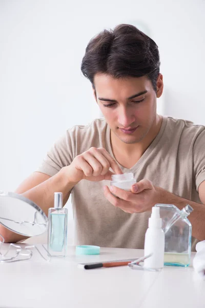 Young handsome man staring in the mirror — Stock Photo, Image