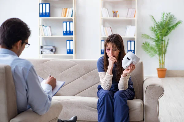 Woman suffering from home violence visiting doctor — Stock Photo, Image