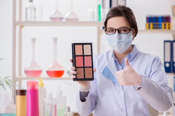 Lab chemist checking beauty and make-up products