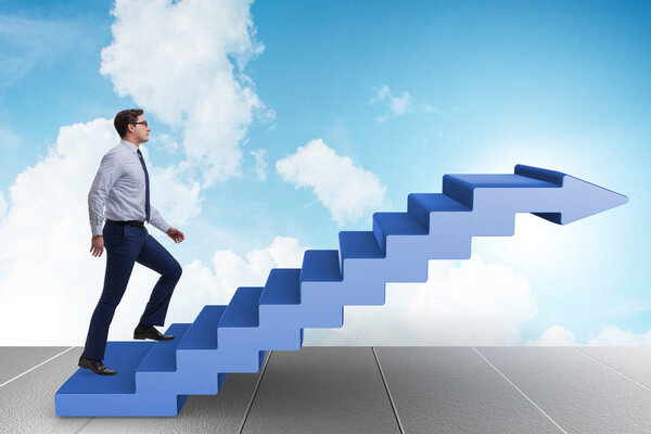 Businessman climbing career ladder in business concept